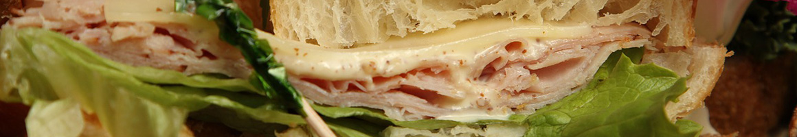 Eating Sandwich Vegan Vegetarian at Le Voyeur restaurant in Olympia, WA.